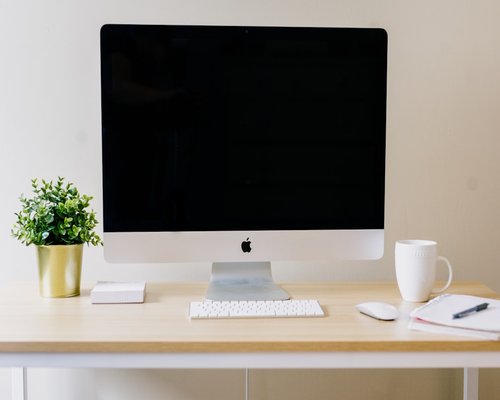 A clean and organized work desk with soft light, representing communication and focus