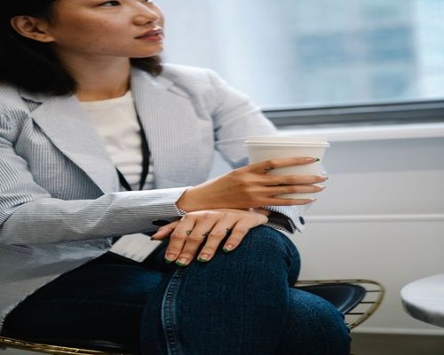 A short break during a regular workday, holding a cup of coffee